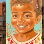 قصة حب وفن تزين شوارع أسوان بالجداريات