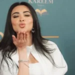 ميرهان حسين تتألق في فستان أبيض جذاب